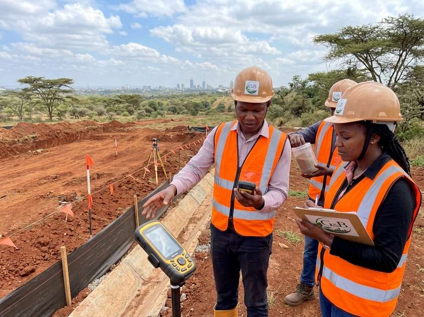 G&B environmental consultants conducting land surveying with GPS equipment at a construction site during an environmental impact assessment in Kenya